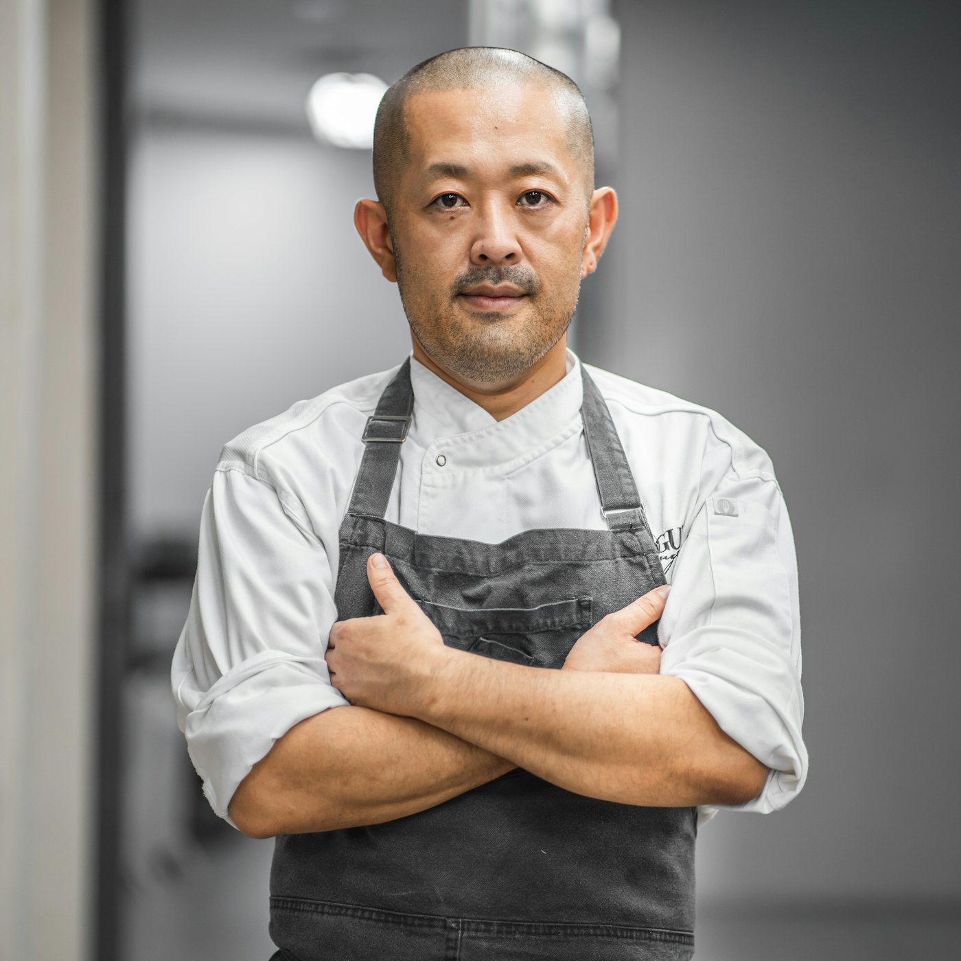 A chef in whites in a professional kitchen